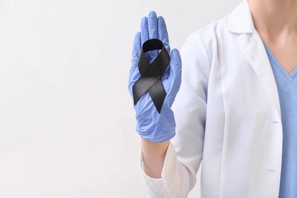 Doctor Black Ribbon Light Background Melanoma Concept — Stock Photo, Image