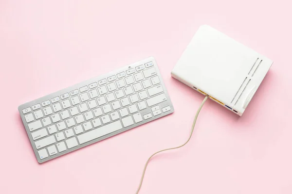Router Internet Cable Computer Keyboard Pink Background — Stock Photo, Image