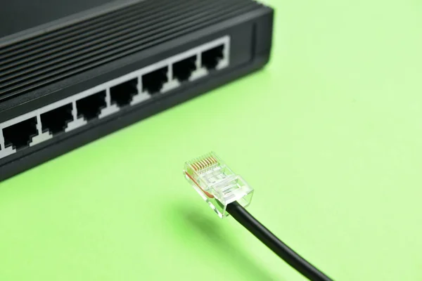 Router Internet Cable Green Background Closeup — Stock Photo, Image