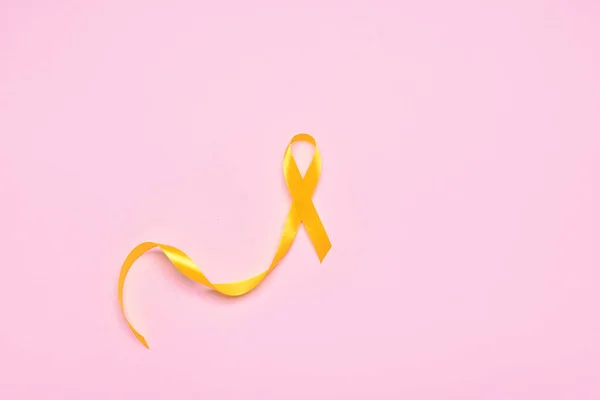 Golden Awareness Ribbon Pink Background International Childhood Cancer Day — Stock Photo, Image