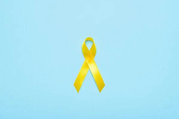 Golden Awareness Ribbon Blue Background International Childhood Cancer Day — Stock Photo, Image