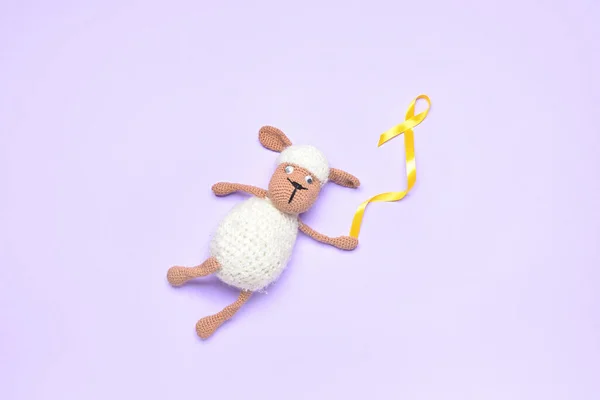 Golden Awareness Ribbon Toy Sheep Violet Background International Childhood Cancer — Stock Photo, Image