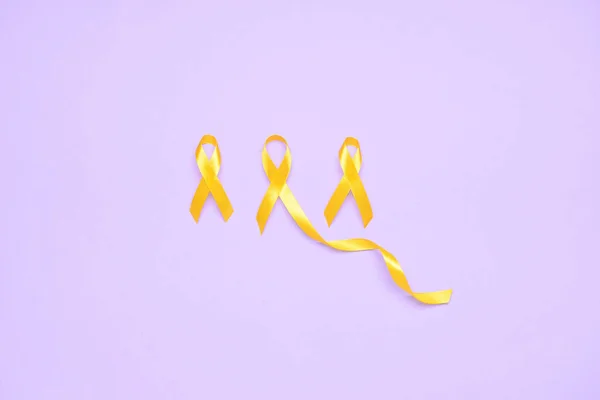 Golden Awareness Ribbons Violet Background International Childhood Cancer Day — Stock Photo, Image