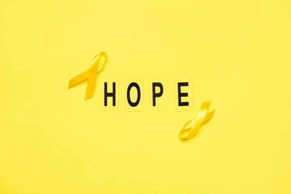 Golden Awareness Ribbons Word Hope Yellow Background International Childhood Cancer — Stock Photo, Image