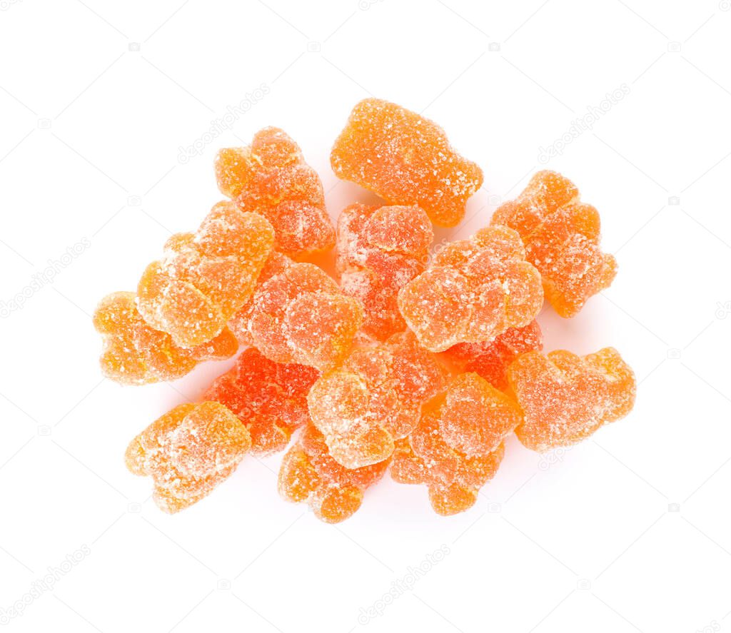 Heap of orange jelly bears on white background