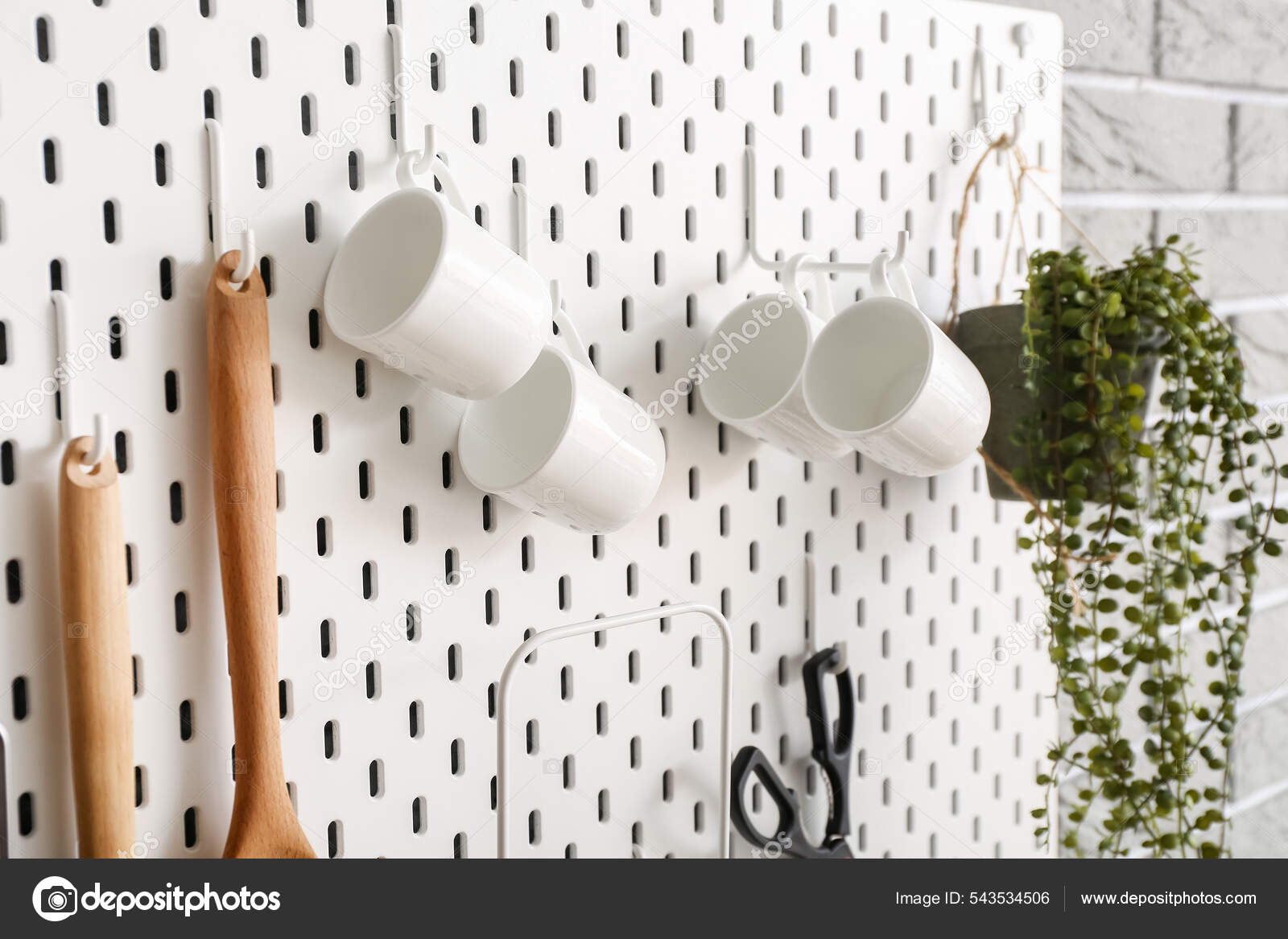 Pegboard Cups Kitchen Utensils Wall Stock Photo by ©serezniy 543534506