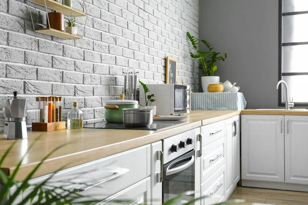 Modern Kitchen Different Utensils Grey Brick Wall — Stock Photo, Image