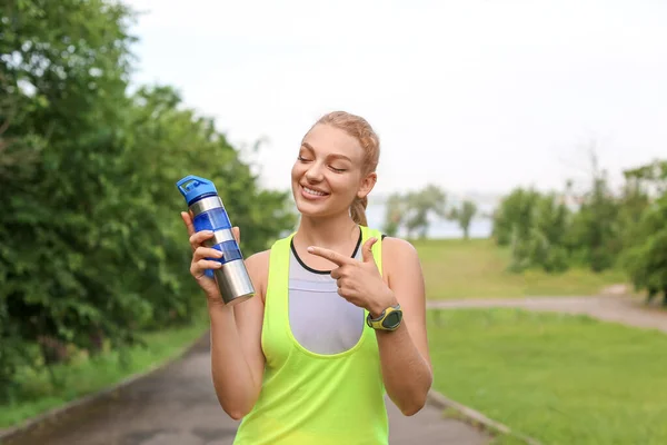 Young Smiling Woman Sportswear Pointing Bottle Protein Shake Outdoors — Stock Photo, Image