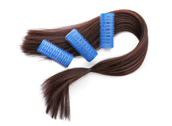 Lange Brünette Haare Mit Lockenwicklern Auf Hellem Hintergrund — Stockfoto