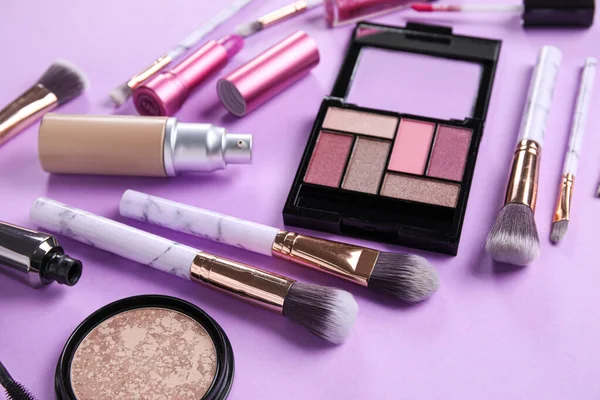 Different Makeup Products Purple Background Closeup — Stock Photo, Image