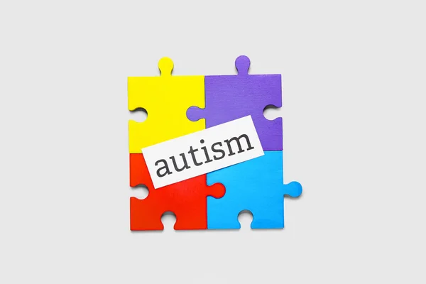 Word Autism Colorful Puzzle Pieces Light Background — Stock Photo, Image