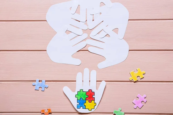 Paper Human Palms Colorful Puzzle Pieces Color Wooden Background Concept — Stock Photo, Image