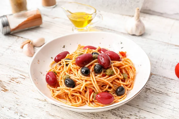 Plate Tasty Pasta Puttanesca White Wooden Background — Stock Photo, Image