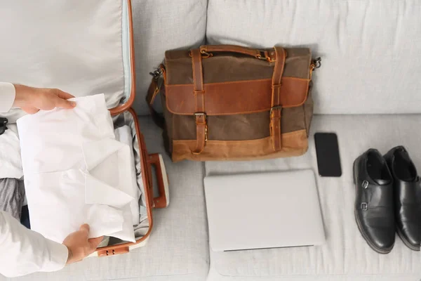 Young Businessman Packing His Shirt Suitcase Home — Stock Photo, Image
