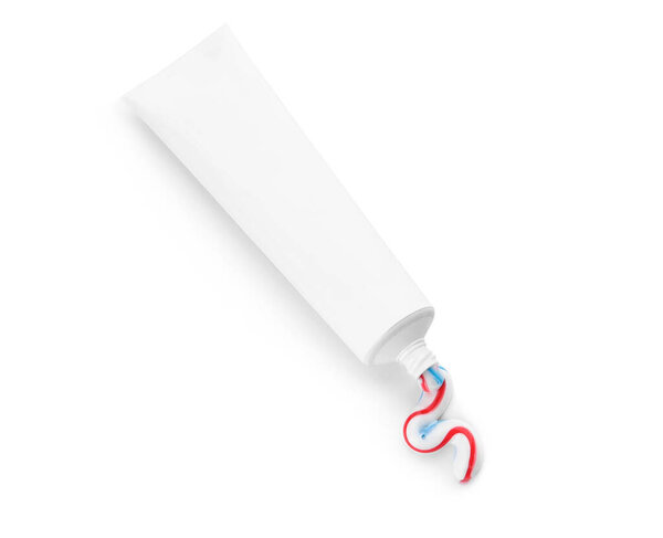 Tube with squeezed toothpaste on white background