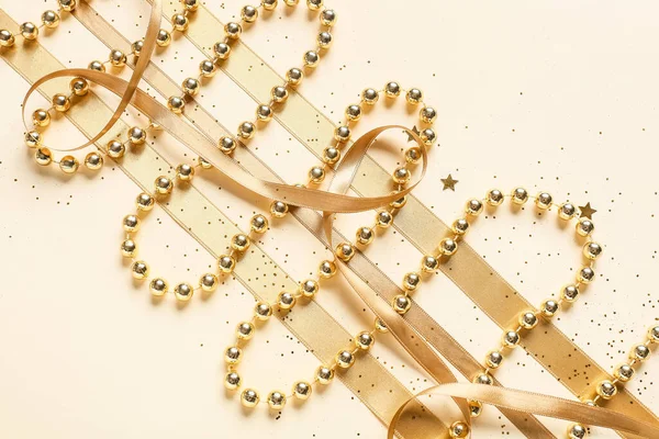 Golden Ribbons Beads Confetti Light Background — Stock Photo, Image