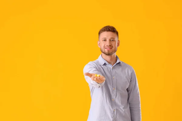 Handsome Young Man Ear Plugs Yellow Background — Stock Photo, Image