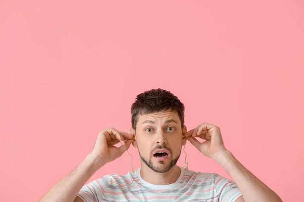 Shocked Handsome Man Ear Plugs Pink Background — Stock Photo, Image