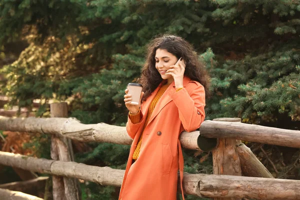 Beautiful Woman Drinking Tea Talking Phone Outdoors — Stock Photo, Image