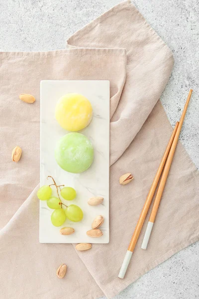 Board Delicious Mochi Grape Pistachios Chopsticks Grunge Background — Stock Photo, Image