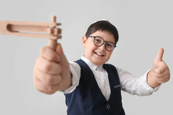 Little Jewish Boy Gragger Purim Holiday Showing Thumb Gesture Grey — Stock Photo, Image