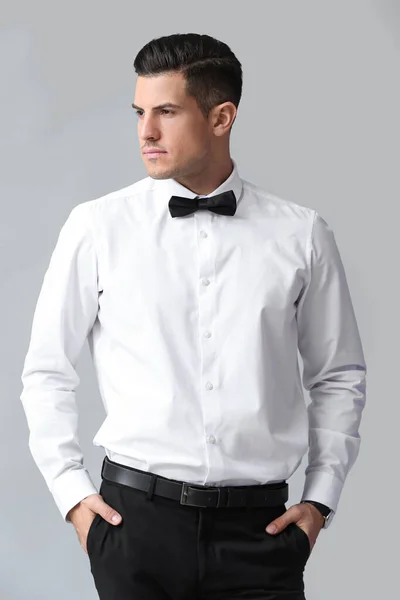 Fashionable Gentleman Keeping Hands Pockets Grey Background — Stock Photo, Image