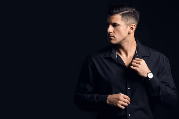 Fashionable Gentleman Adjusting Shirt Dark Background — Stock Photo, Image