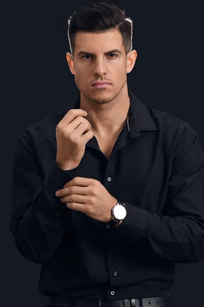 Portrait Fashionable Gentleman Adjusting Sleeve Dark Background — Stock Photo, Image