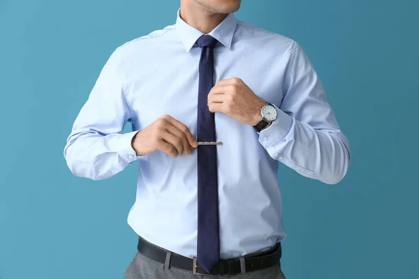 Handsome Man Formal Clothes Adjusting Tie Color Background Closeup — Stock Photo, Image