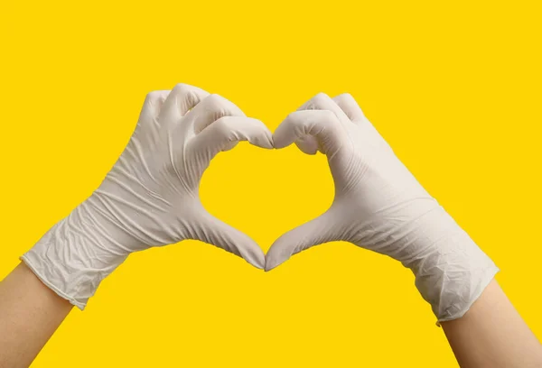 Woman White Medical Gloves Making Heart Shape Her Hands Yellow — Stock Photo, Image