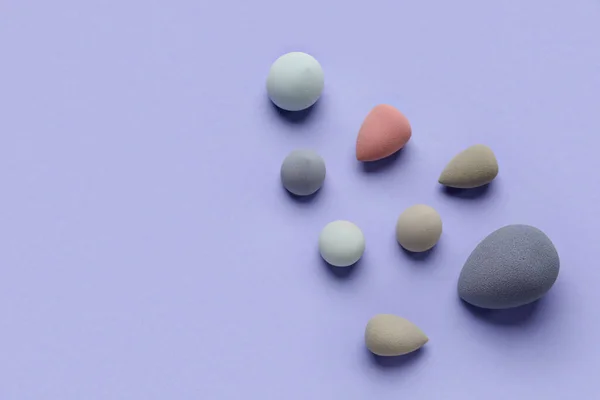 Different Makeup Sponges Purple Background — Stock Photo, Image