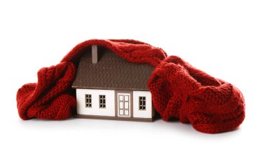 House model with red scarf on white background. Heating concept clipart