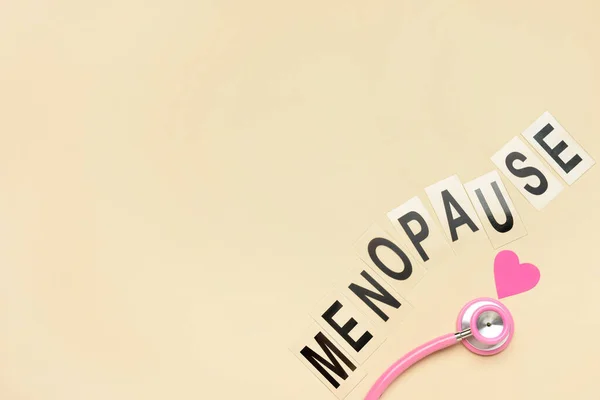 Word Menopause Stethoscope Paper Heart Beige Background — Stock Photo, Image