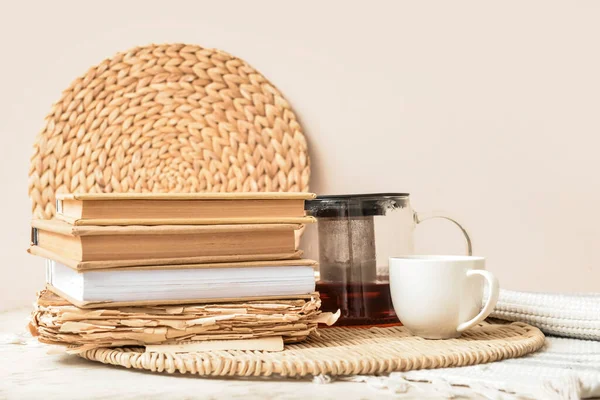 Stack Books Teapot Cup Wicker Tray Light Wall — Stock Photo, Image