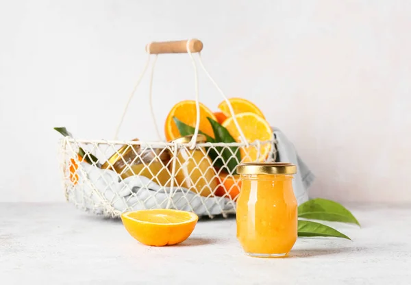 Glass Jar Tasty Orange Jam Light Background — Stock Photo, Image