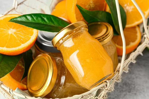 Basket Tasty Orange Jam Jars Leaves Table Closeup — Stock Photo, Image