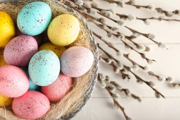 Bowl Beautiful Easter Eggs Pussy Willow Branches Light Wooden Background — стоковое фото