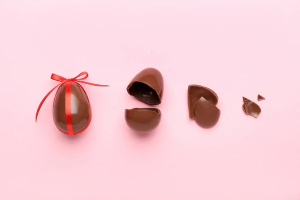 Composition Broken Chocolate Easter Eggs Pink Background — Stock Photo, Image