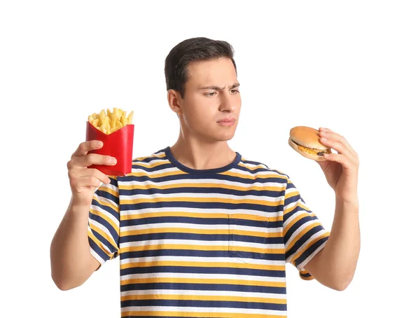 Jovem Estressado Com Batatas Fritas Hambúrguer Fundo Branco — Fotografia de Stock