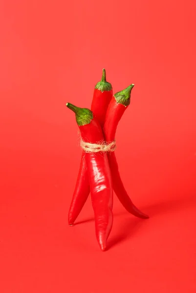 Bundle Hot Chili Peppers Red Background — Stock Photo, Image