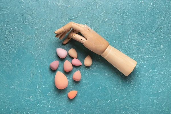 Wooden Hand Different Makeup Sponges Color Background — Stock Photo, Image