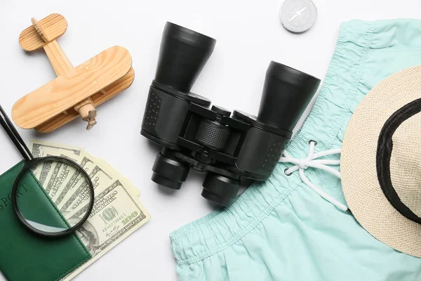 Composition Binoculars Clothes Money Wooden Plane White Background — Stock Photo, Image