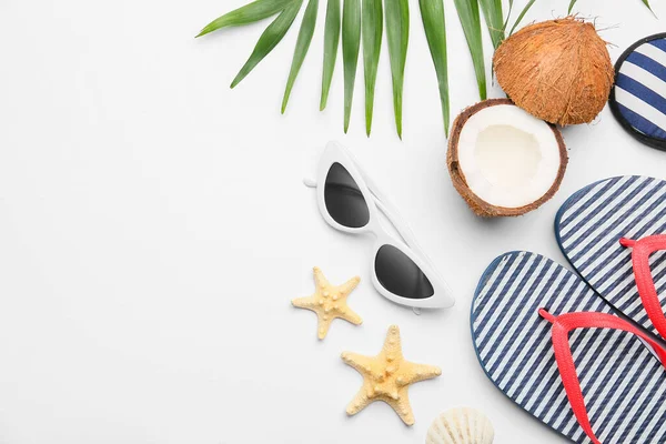Stylish Sunglasses Flip Flops Coconut Starfishes White Background — Stock Photo, Image