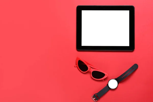 Tablet Computer Smart Watch Sunglasses Red Background — Stock Photo, Image