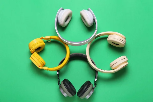 Different Headphones Green Background — Stock Photo, Image