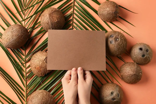 Female Hands Blank Card Coconuts Palm Leaves Color Background — Stock Photo, Image