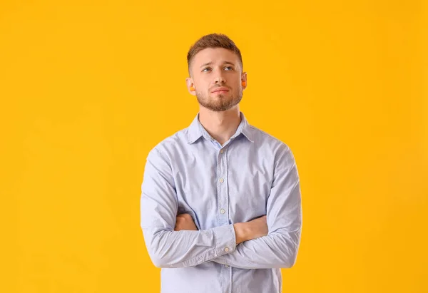 Thoughtful Young Man Ear Plugs Yellow Background — Stock Photo, Image