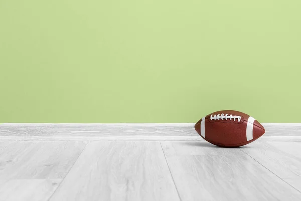 Rugby Ball Floor Green Wall — Stock Photo, Image