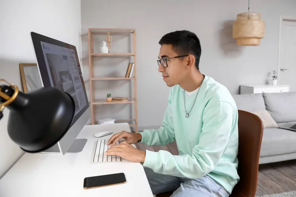 Young Man Using Computer Booking Hotel Room Online Home — Stock Photo, Image