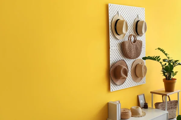 Pegboard Hats Bag Hanging Yellow Wall — Stock Photo, Image